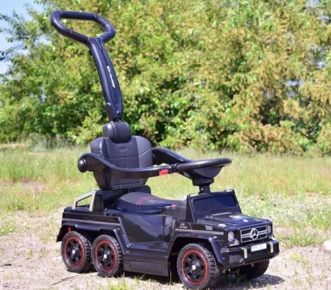 JEŹDZIK NA AKUMULATOR, PCHACZ, ODPYCHACZ MERCEDES G 63 AMG 6X6, MIĘKKIE KOŁA, DASZEK , STEROWANIE RĄCZKĄ /1838 LONG